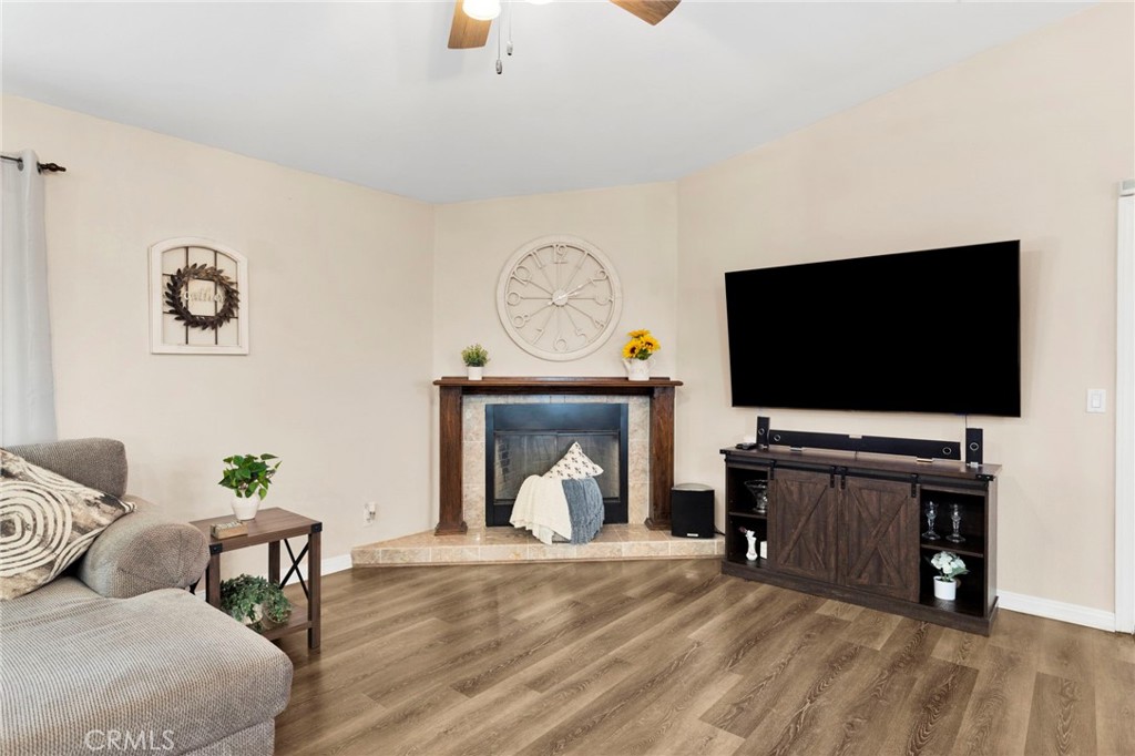 21237 S Road Apple Valley, CA 92307 - Photo 16 of 50 a living room with furniture and a flat screen tv