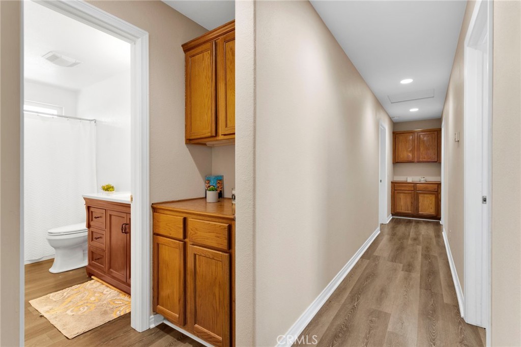 21237 S Road Apple Valley, CA 92307 - Photo 17 of 50 a bathroom with a toilet sink and mirror