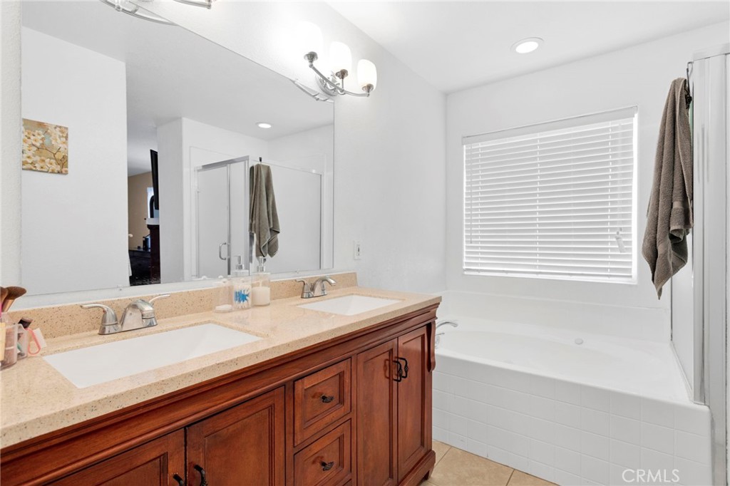 21237 S Road Apple Valley, CA 92307 - Photo 23 of 50 a bathroom with a sink double vanity and a bathtub