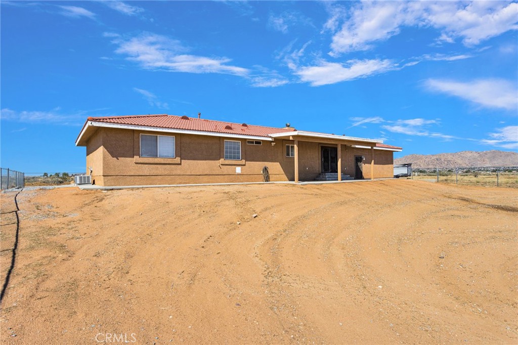 21237 S Road Apple Valley, CA 92307 - Photo 35 of 50 a view of a house with a yard
