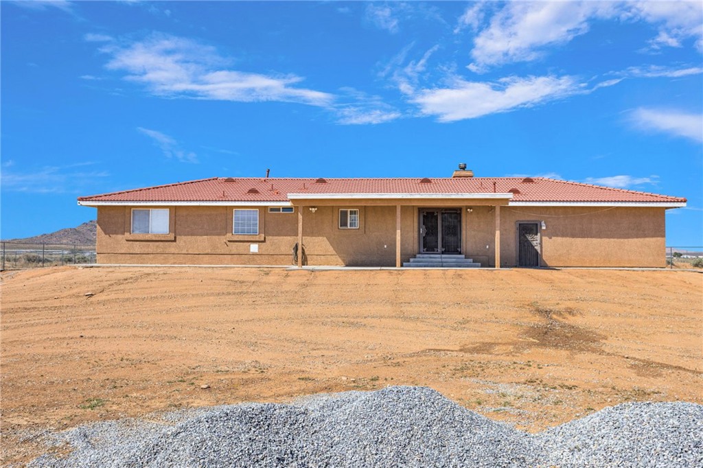 21237 S Road Apple Valley, CA 92307 - Photo 36 of 50 a front view of a house with a yard