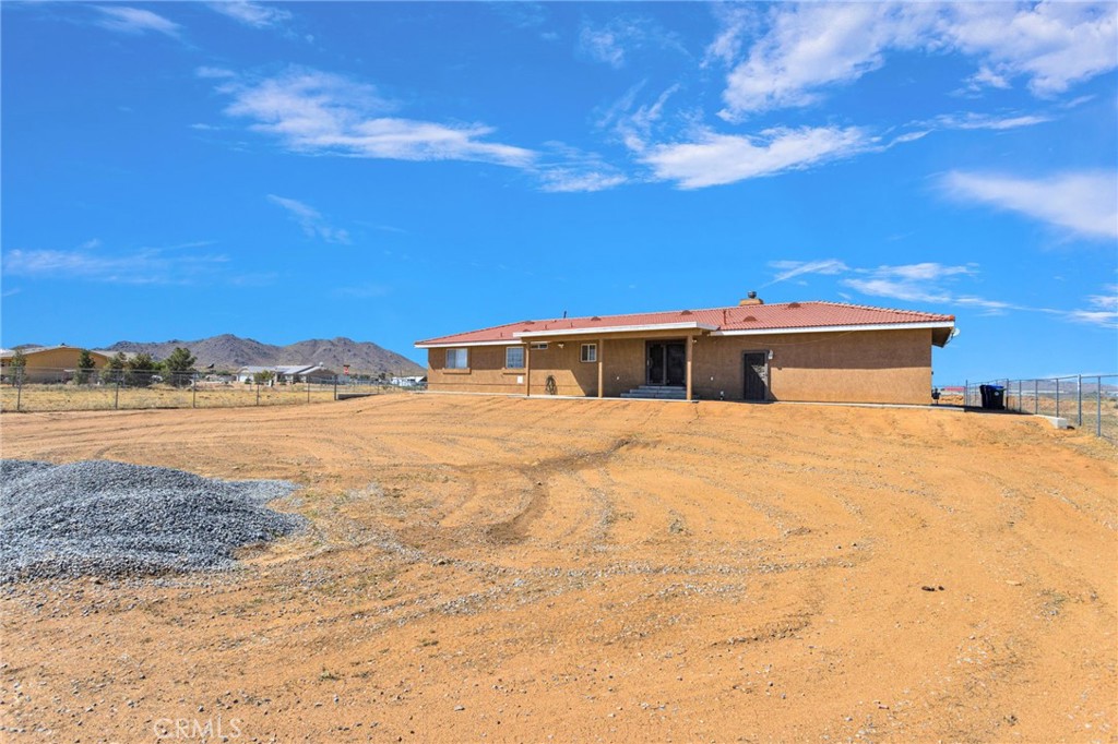 21237 S Road Apple Valley, CA 92307 - Photo 37 of 50 a front view of a house with a yard
