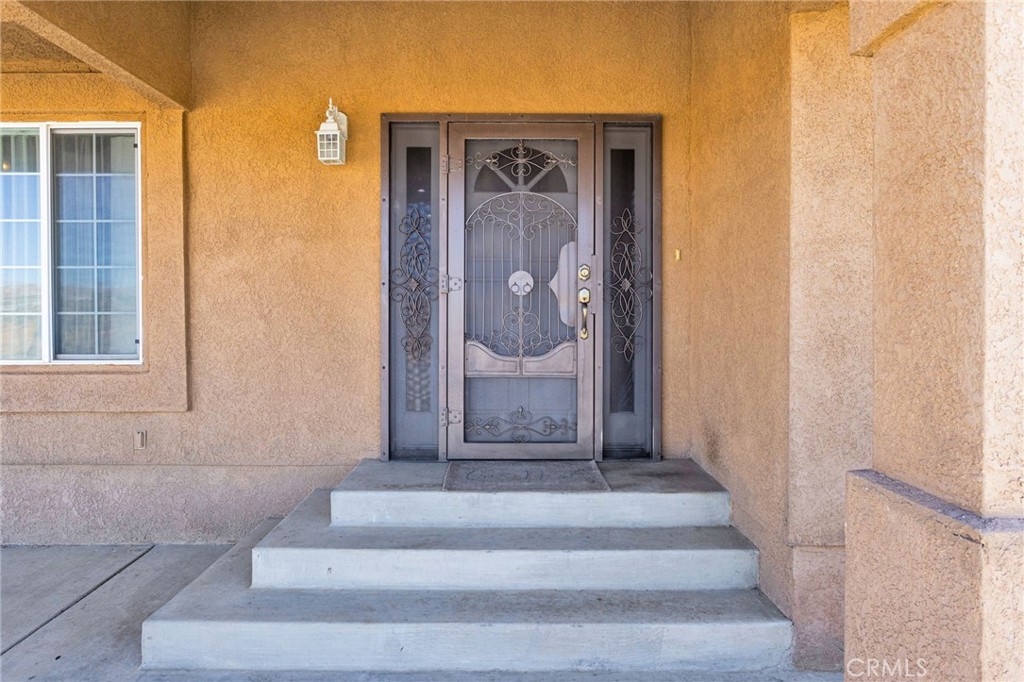 21237 S Road Apple Valley, CA 92307 - Photo 5 of 50 a view of staircase with white walls
