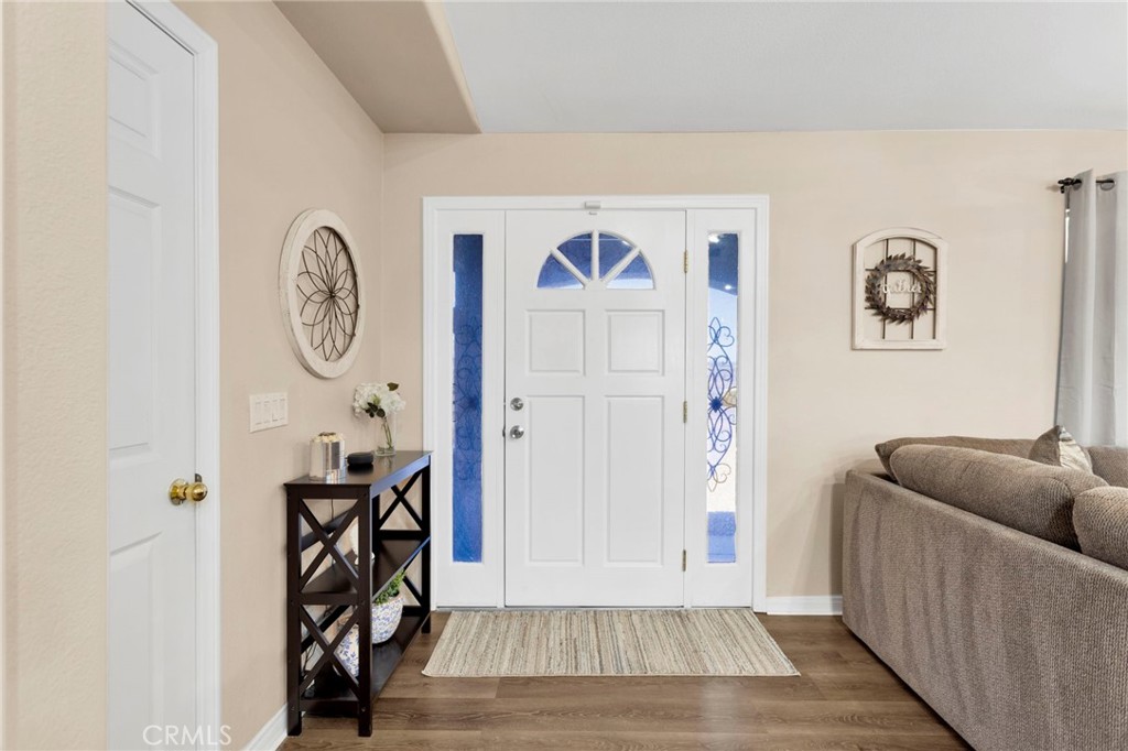21237 S Road Apple Valley, CA 92307 - Photo 6 of 50 a living room with furniture and a window