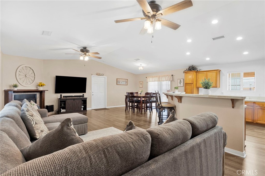 21237 S Road Apple Valley, CA 92307 - Photo 7 of 50 a living room with furniture and a flat screen tv