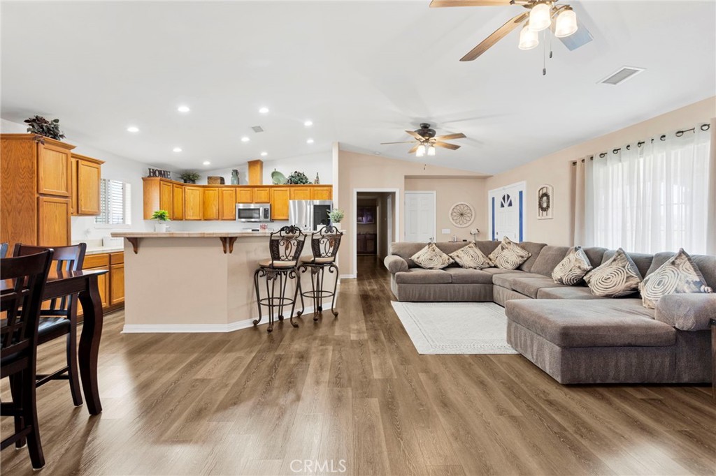 21237 S Road Apple Valley, CA 92307 - Photo 9 of 50 a living room with furniture and kitchen view