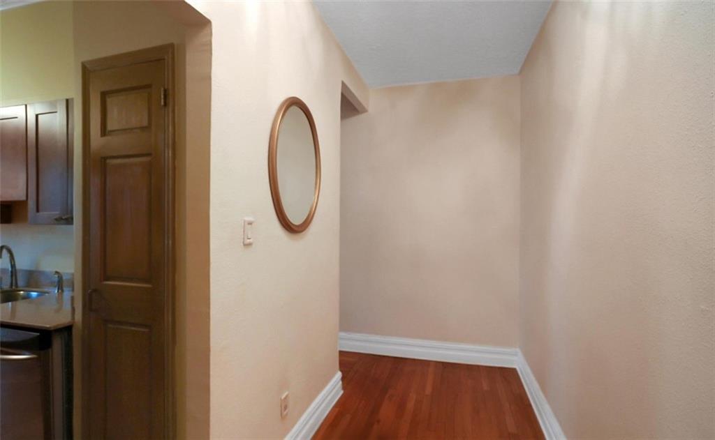 7101 Colonial Road, Unit R2B Brooklyn, NY 11209 - Photo 5 of 10 a bathroom with a sink and a mirror