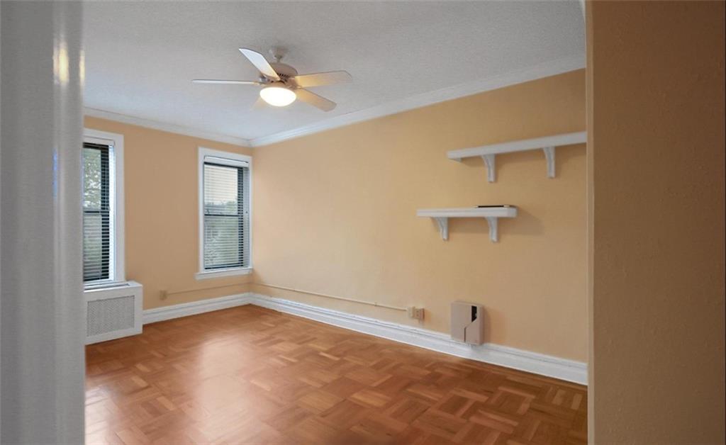 7101 Colonial Road, Unit R2B Brooklyn, NY 11209 - Photo 6 of 10 an empty room with windows and closet