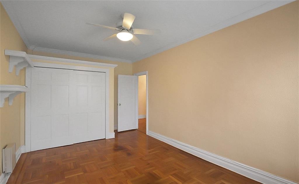 7101 Colonial Road, Unit R2B Brooklyn, NY 11209 - Photo 7 of 10 an empty room with a chandelier fan