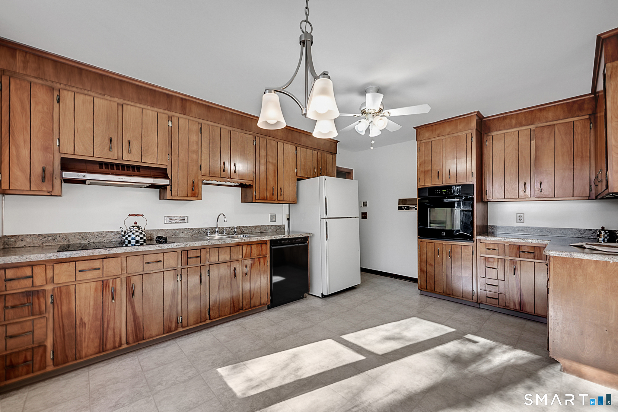67 Hillside Lane Monroe, CT 06468 - Photo 12 of 40 With ample room for a table, this kitchen is designed to be both functional and inviting.