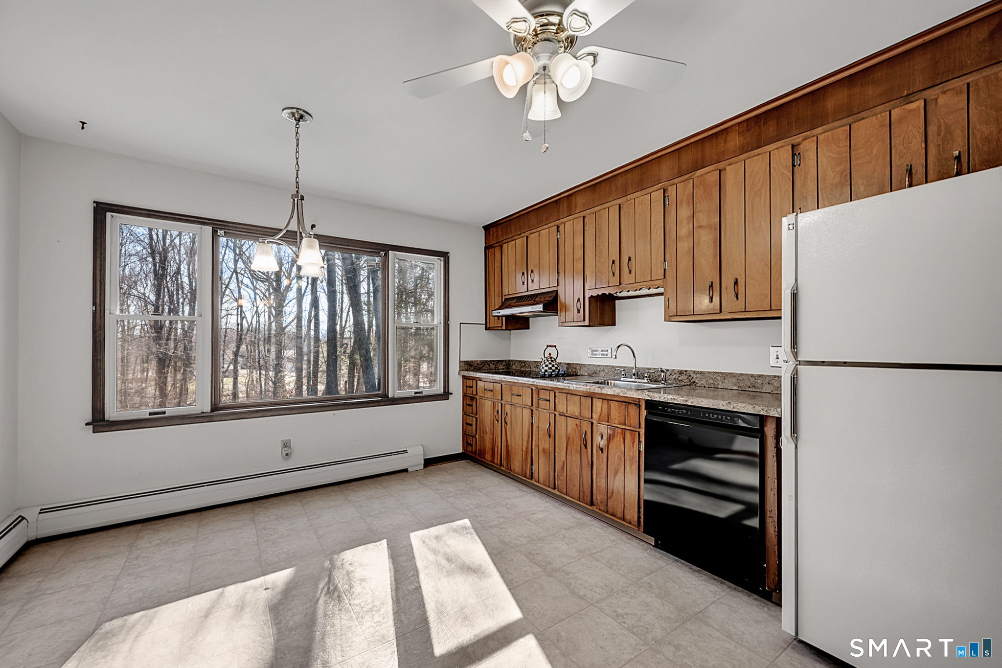 67 Hillside Lane Monroe, CT 06468 - Photo 13 of 40 With a wonderful huge window, natural light pours into the room making the space bright and airy.