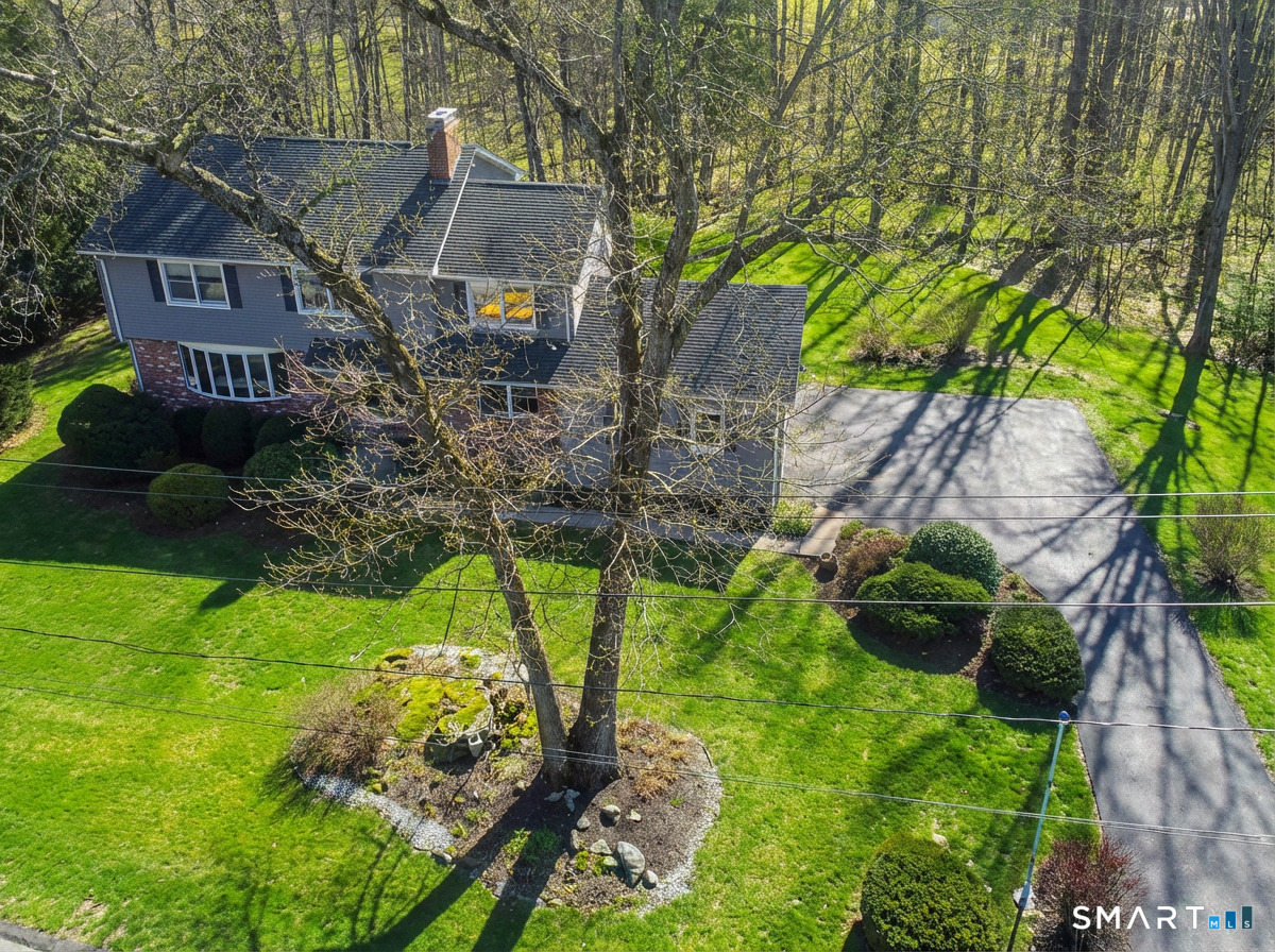 67 Hillside Lane Monroe, CT 06468 - Photo 2 of 40 The home is nestled on a picturesque 1.04 acres.