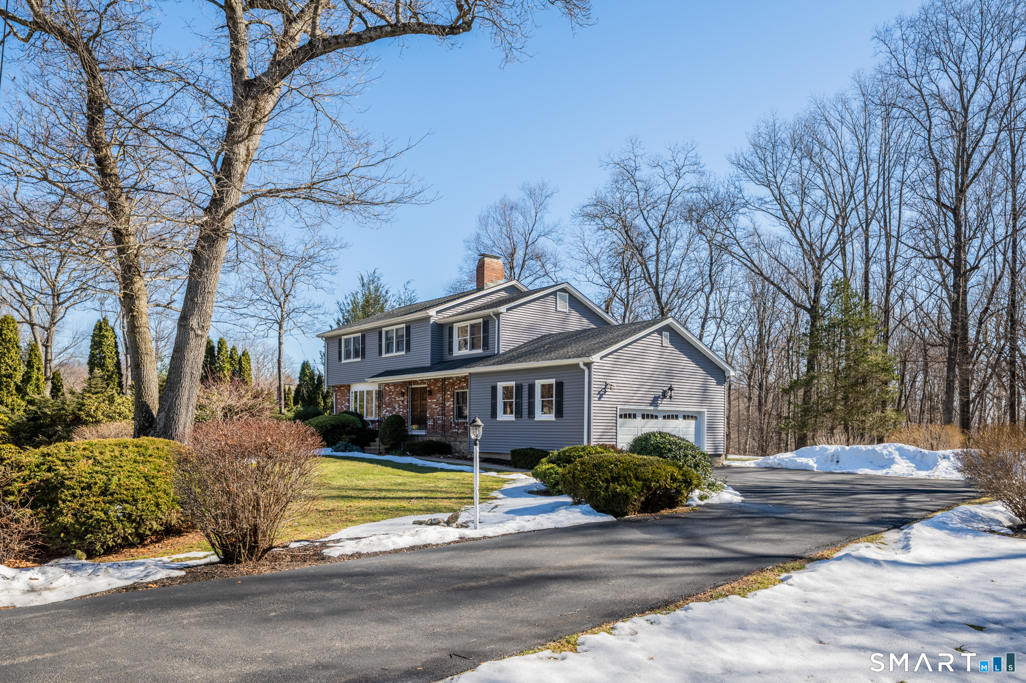 67 Hillside Lane Monroe, CT 06468 - Photo 32 of 40 This flat property offers an inviting blend of natural beauty & functional space. The lush landscape features beautiful plantings & shrubs that create a magical space. The driveway is generously sized, capable of accommodating multiple vehicles.