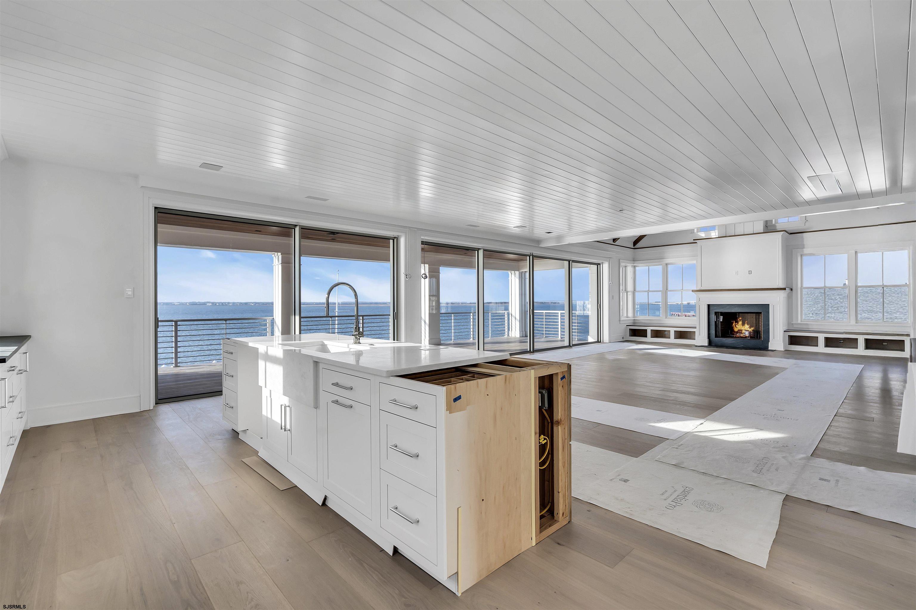 176-80 Bay Road Ocean City, NJ 08226 - Photo 14 of 58 a living room with stainless steel appliances granite countertop furniture and a kitchen view