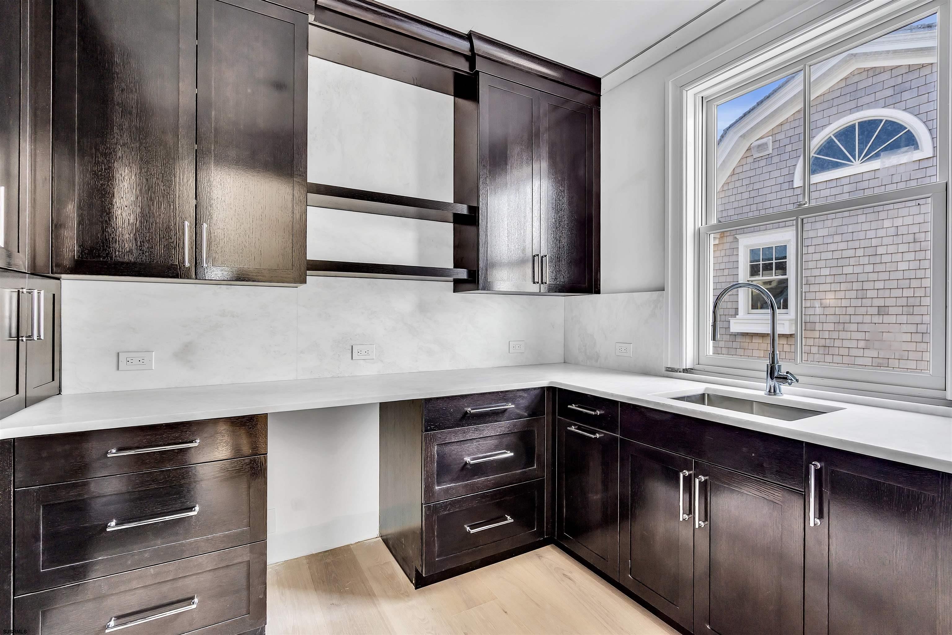 176-80 Bay Road Ocean City, NJ 08226 - Photo 17 of 58 a kitchen with a sink and a refrigerator