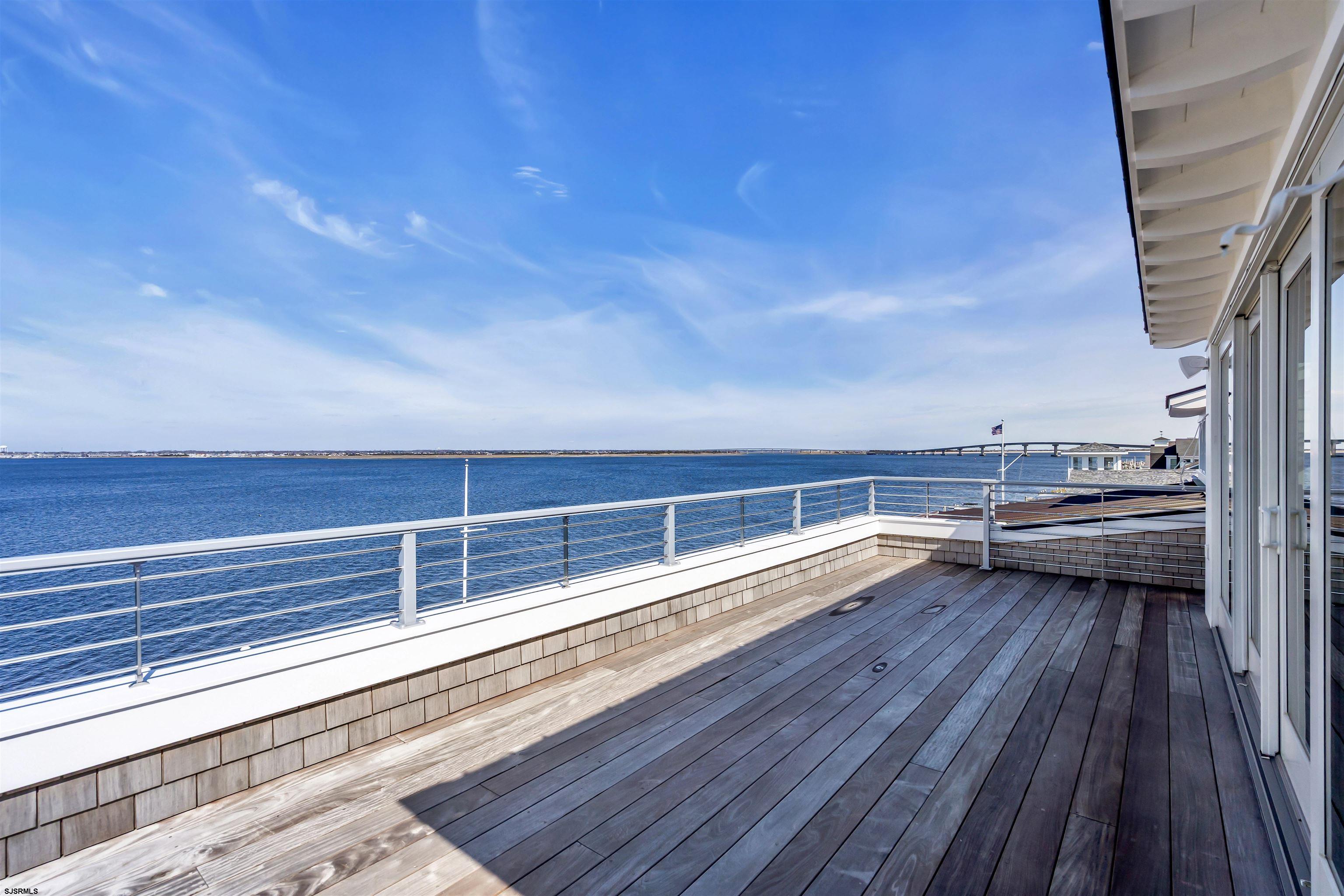 176-80 Bay Road Ocean City, NJ 08226 - Photo 29 of 58 a view of roof deck with wooden floor and seating space