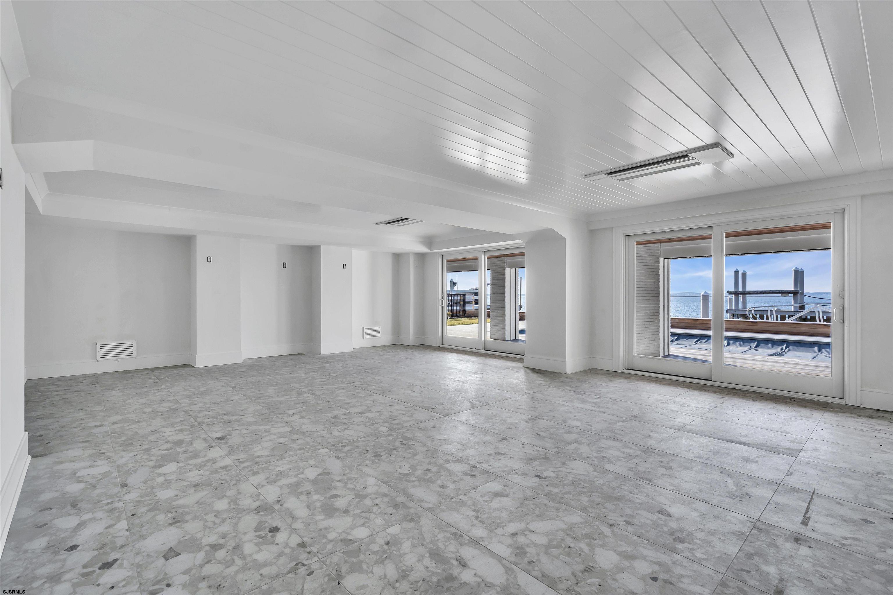176-80 Bay Road Ocean City, NJ 08226 - Photo 35 of 58 a view of a livingroom with an empty space and a window