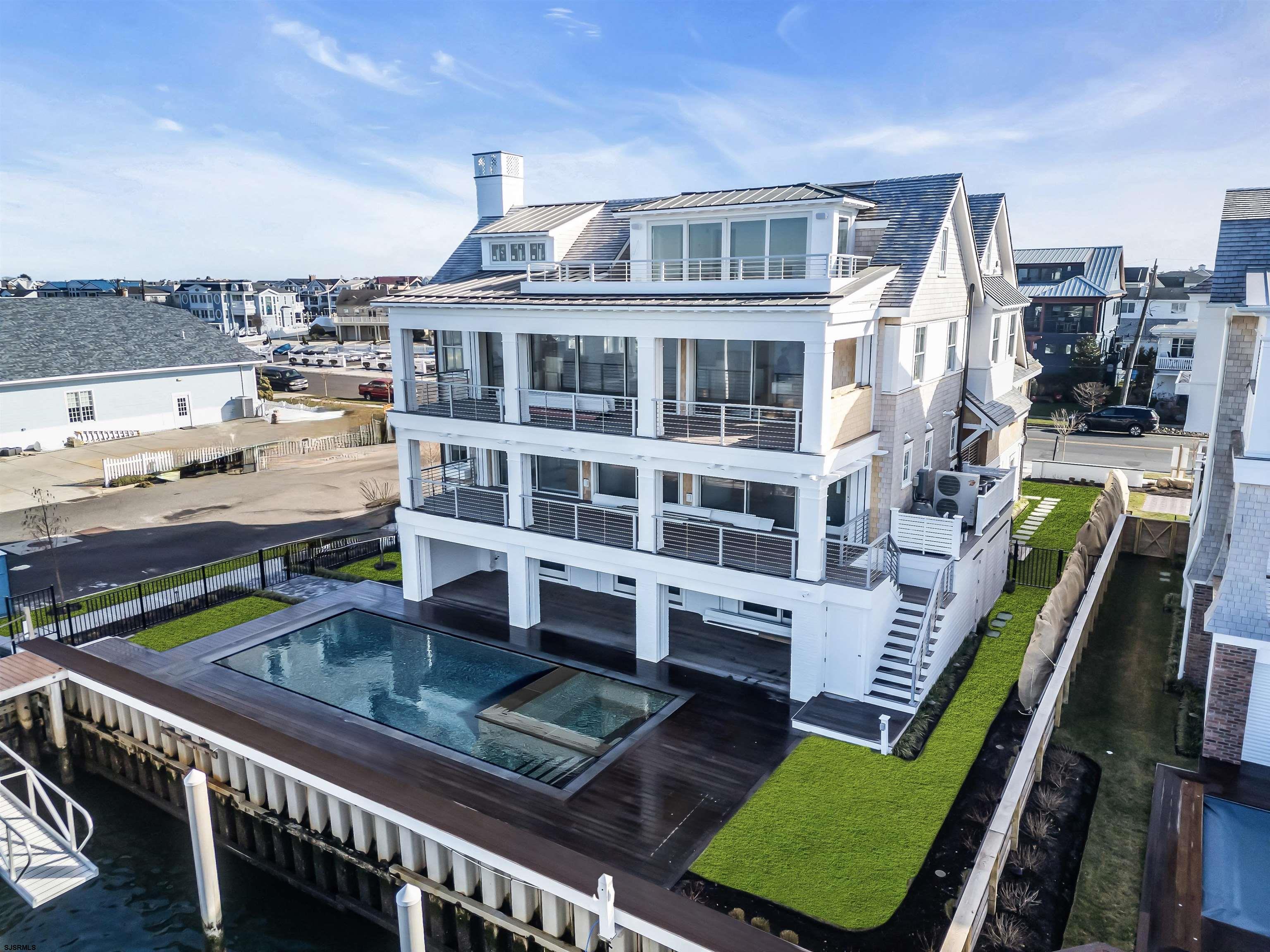 176-80 Bay Road Ocean City, NJ 08226 - Photo 43 of 58 a front view of a house with a garden