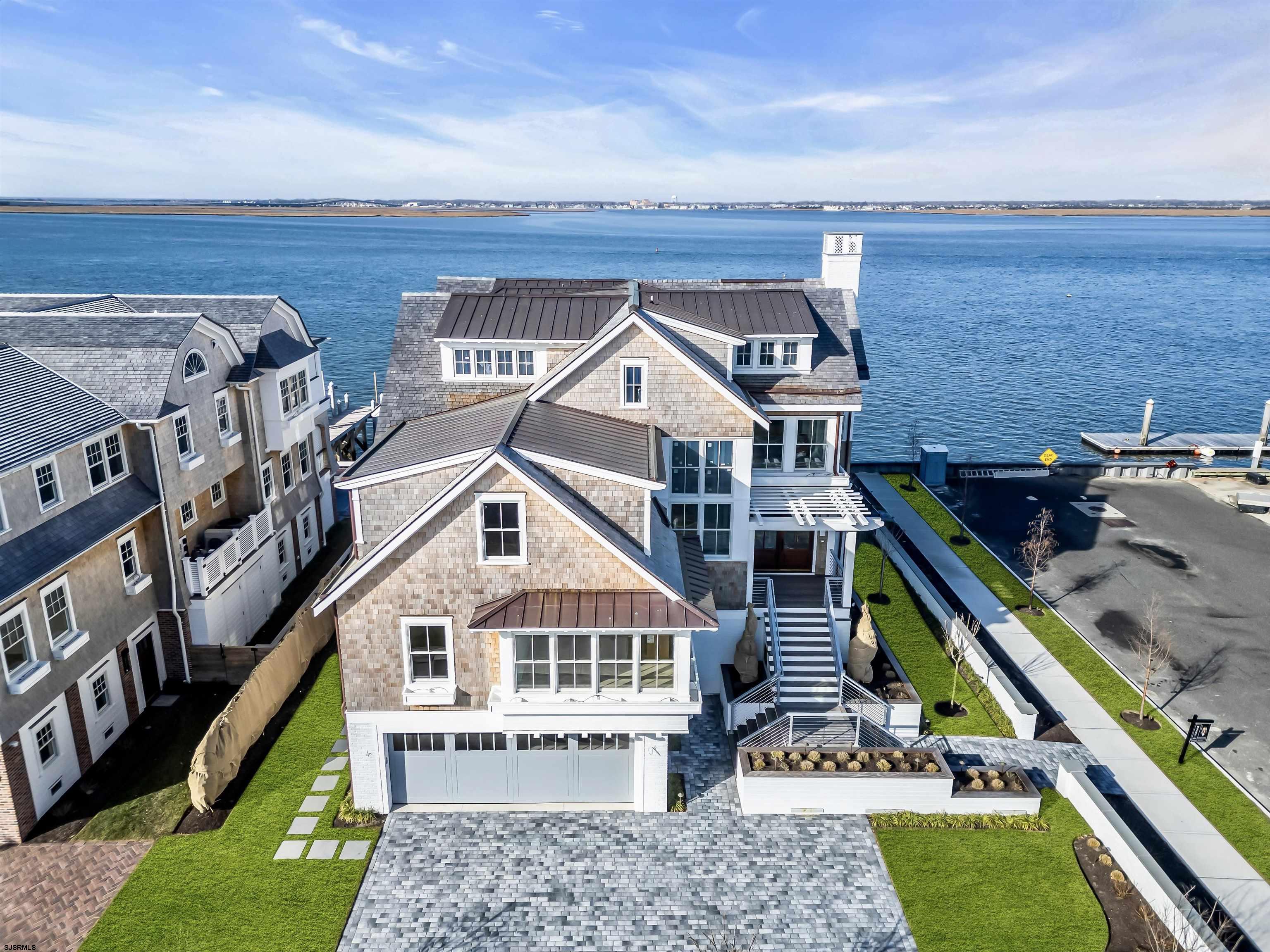 176-80 Bay Road Ocean City, NJ 08226 - Photo 47 of 58 front view of a house with a small yard