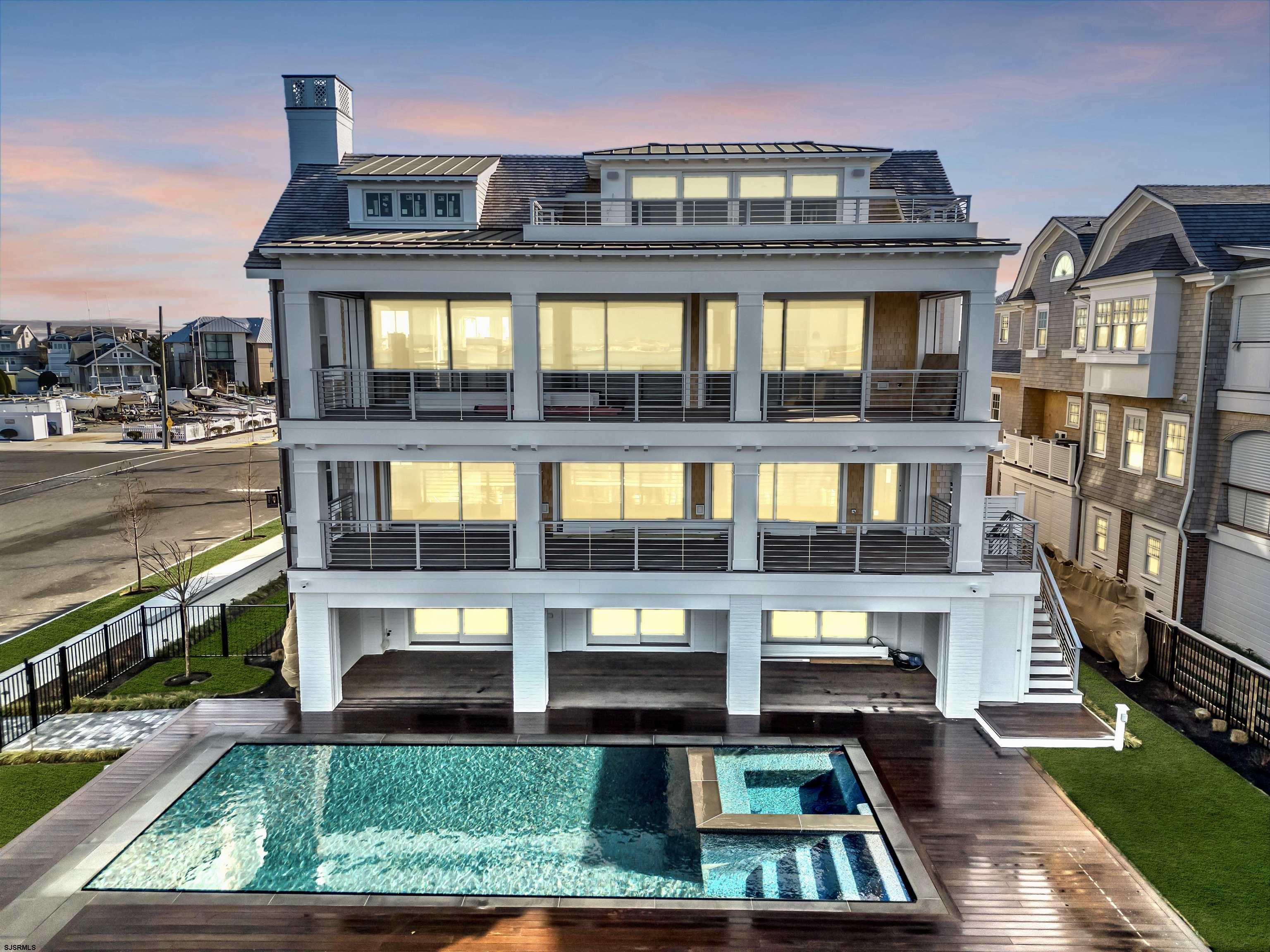 176-80 Bay Road Ocean City, NJ 08226 - Photo 50 of 58 a front view of a residential apartment building with a yard