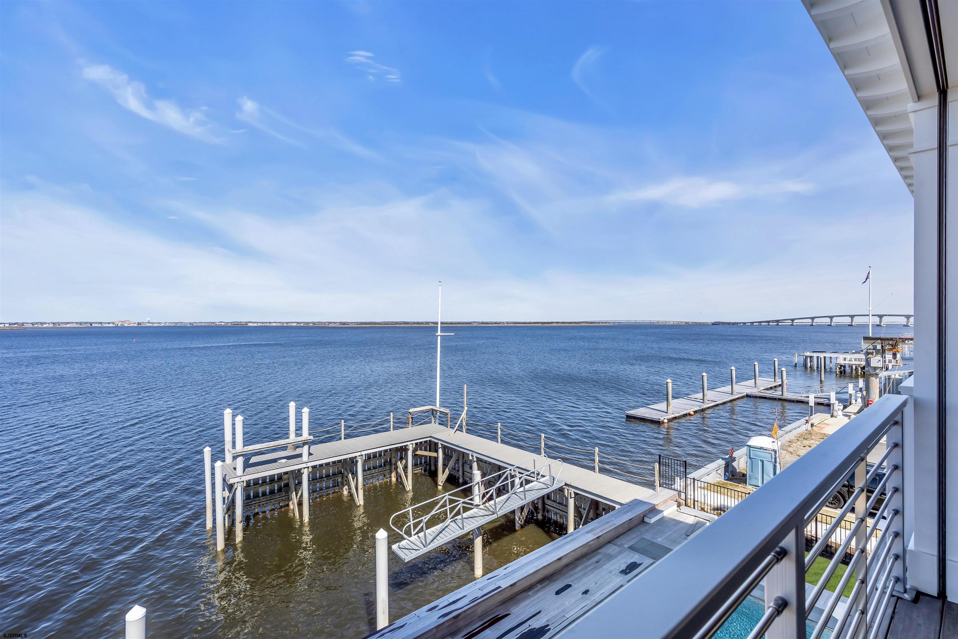 176-80 Bay Road Ocean City, NJ 08226 - Photo 56 of 58 a view of a roof deck with two couches and wooden floor