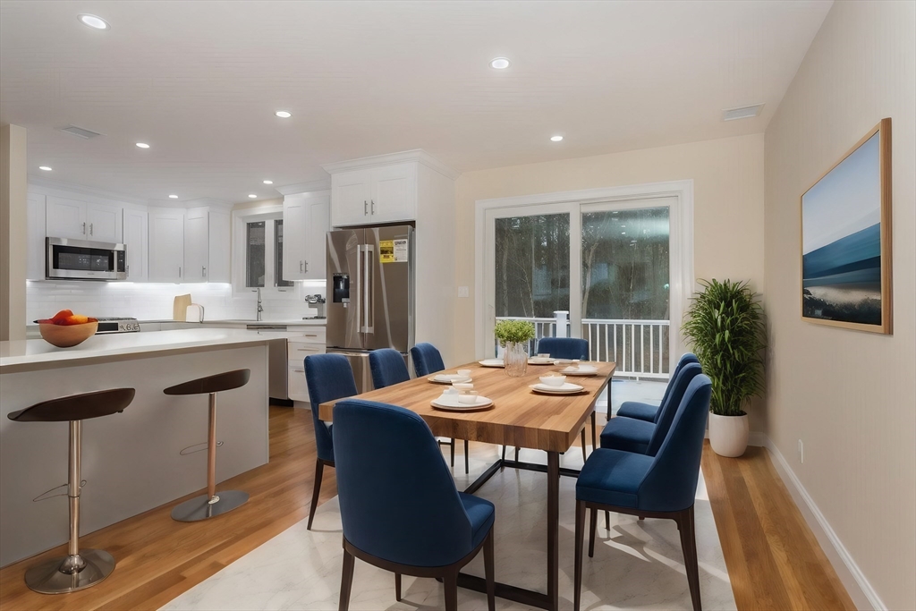 71 Morton Street Canton, MA 02021 - Photo 11 of 39 a kitchen with a table and chairs in it