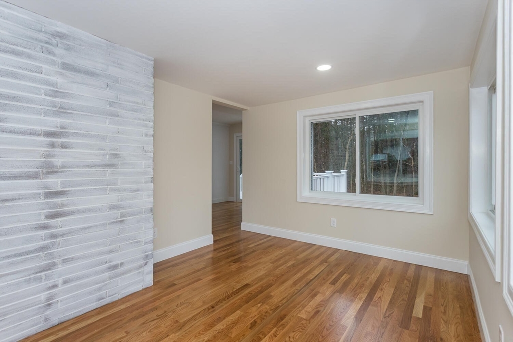 71 Morton Street Canton, MA 02021 - Photo 16 of 39 a view of an empty room with wooden floor and a window