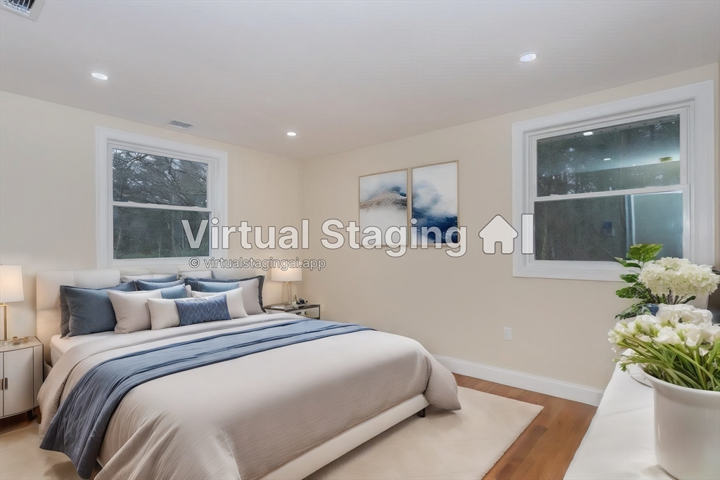 71 Morton Street Canton, MA 02021 - Photo 18 of 39 a bedroom with a bed and a potted plant