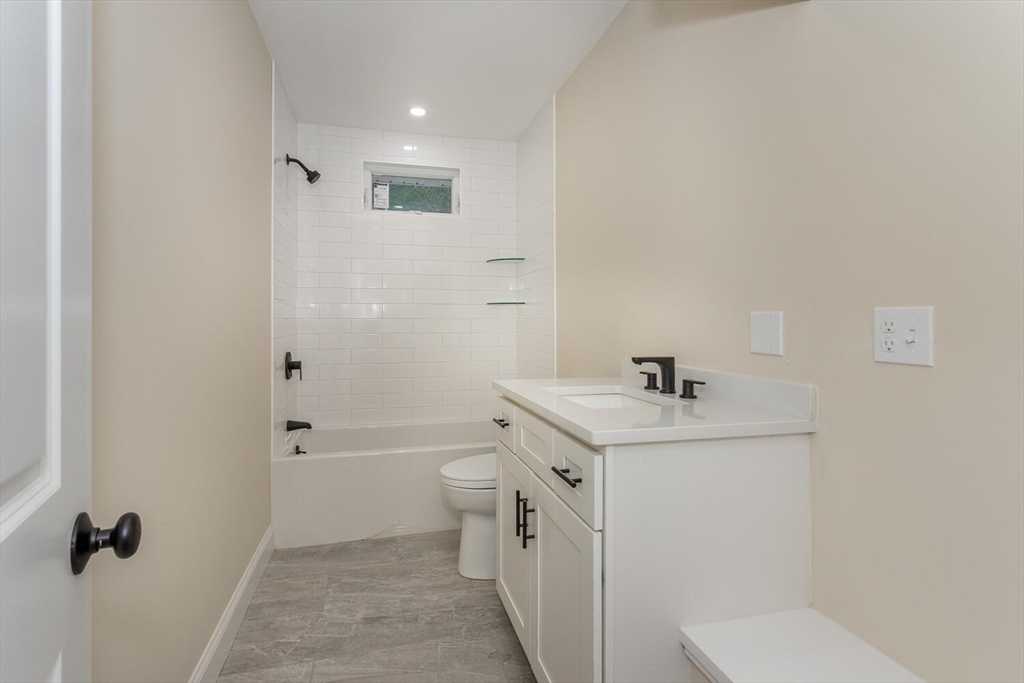 71 Morton Street Canton, MA 02021 - Photo 24 of 39 a bathroom with a sink a toilet and shower