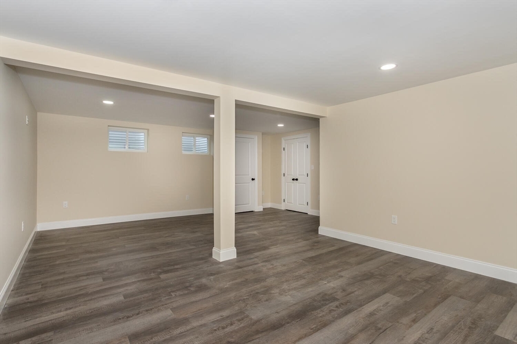 71 Morton Street Canton, MA 02021 - Photo 26 of 39 a view of an empty room with wooden floor