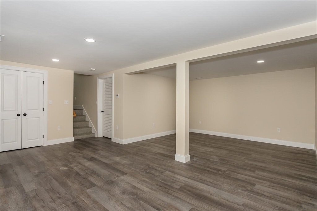 71 Morton Street Canton, MA 02021 - Photo 27 of 39 a view of an empty room with wooden floor