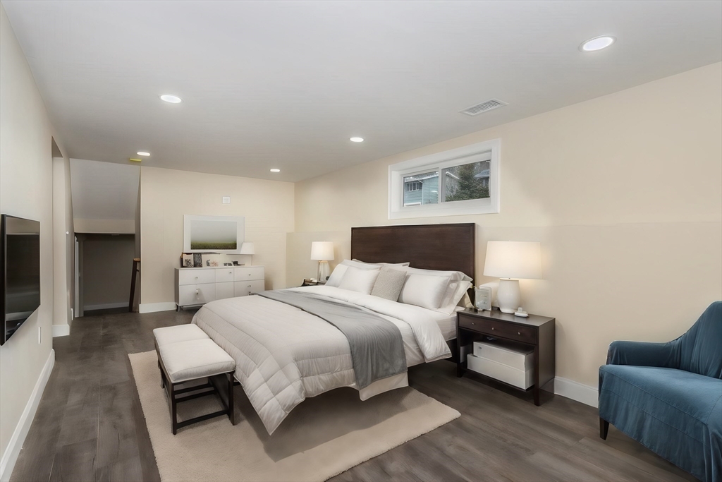 71 Morton Street Canton, MA 02021 - Photo 30 of 39 a bedroom with a bed and a couch