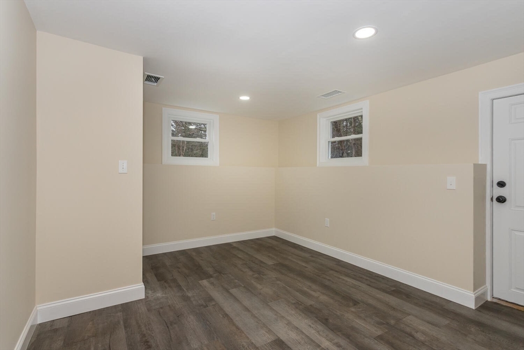 71 Morton Street Canton, MA 02021 - Photo 32 of 39 a view of room with wooden floor and window