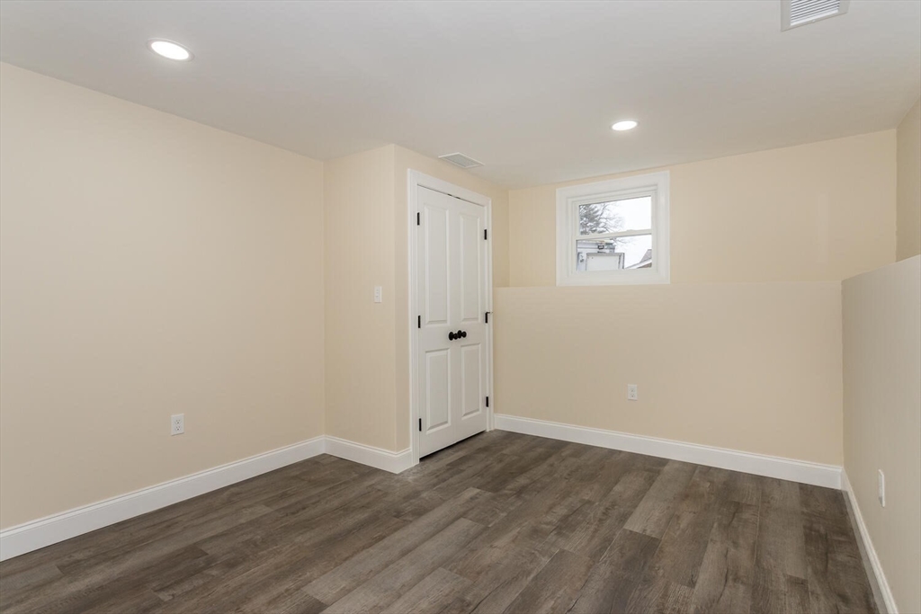 71 Morton Street Canton, MA 02021 - Photo 33 of 39 a view of an empty room with wooden floor