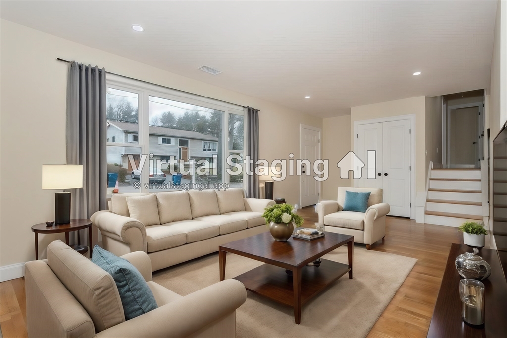 71 Morton Street Canton, MA 02021 - Photo 7 of 39 a living room with furniture and a large window