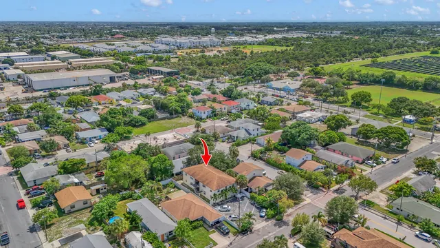 an aerial view of a house with yard swimming pool and outdoor seating