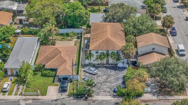 an aerial view of a house with a garden and swimming pool