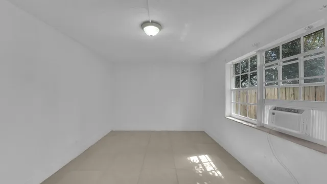 a kitchen with cabinets stainless steel appliances and a counter space