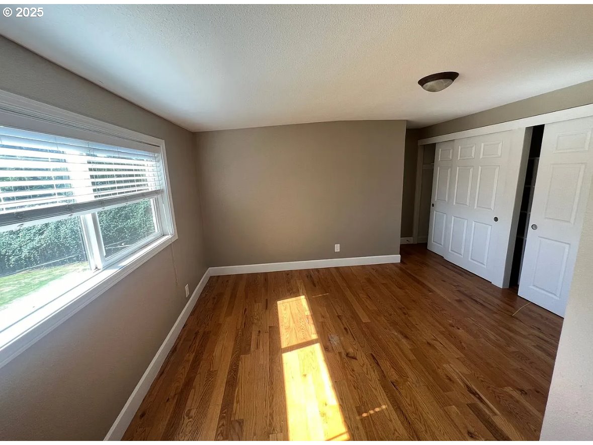 8031 Southeast Orient Drive Gresham, OR 97080 - Photo 7 of 17 a view of wooden floor in an empty room
