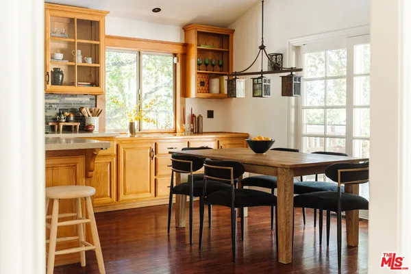a open dining room with furniture and window