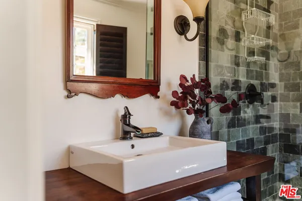 a bathroom with a sink and a mirror