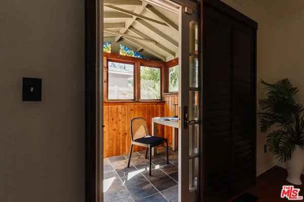 a view of a front door and deck of the house