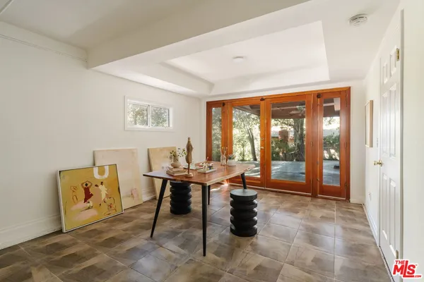 a workspace with furniture and window