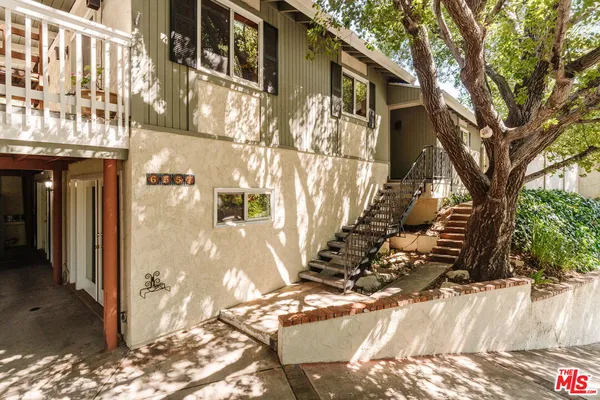 a view of a yard covered with snow on the road