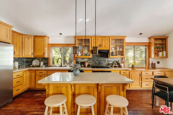 a dining table with chairs and window