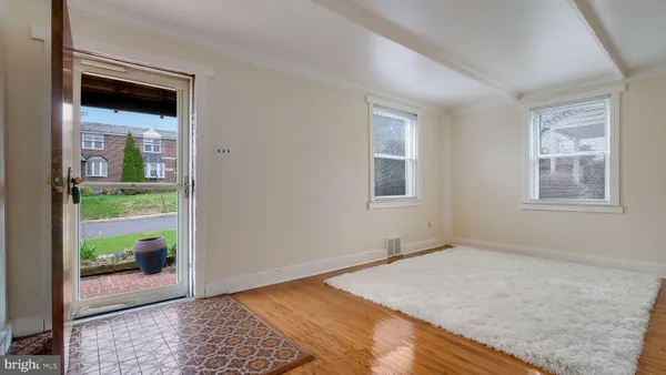 a view of an empty room and a window
