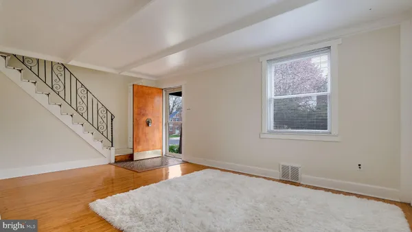 a view of an entryway with wooden floor
