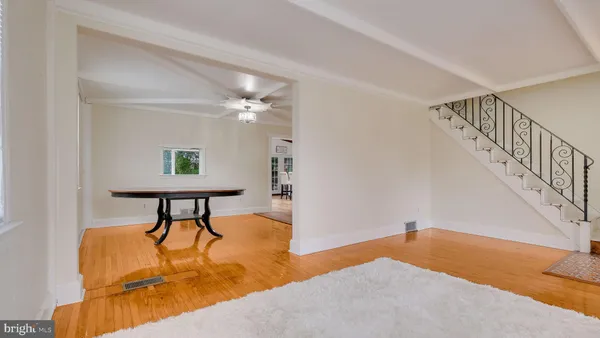 a view of a livingroom with furniture and a workspace