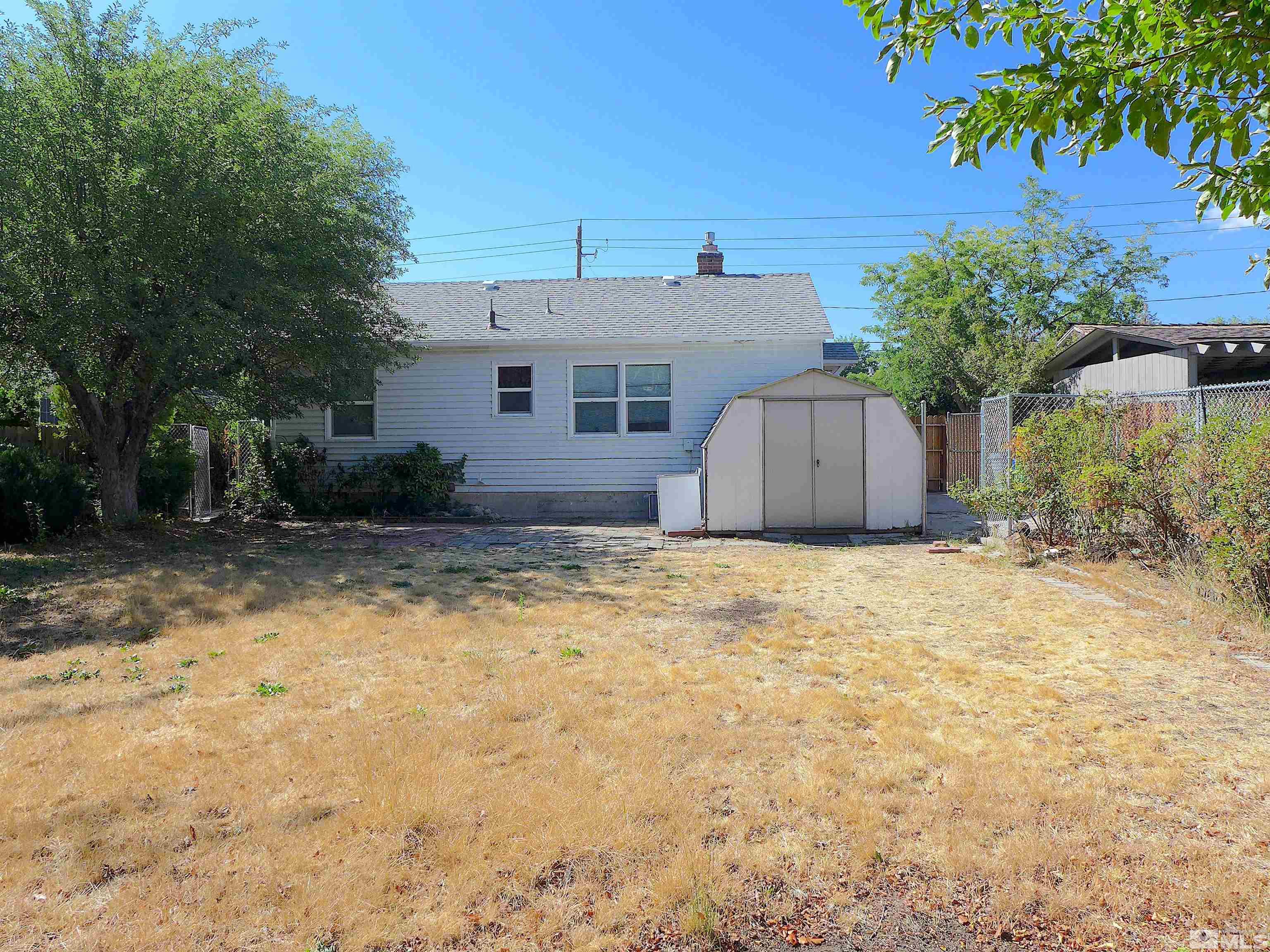 1285 Tacoma Way Reno, NV 89509 - Photo 7 of 10 a view of a house with a yard