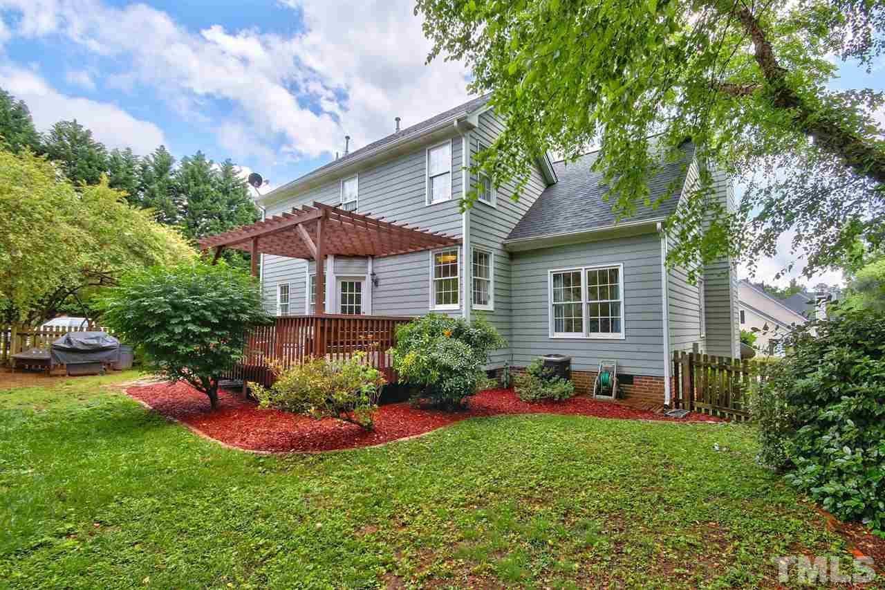 5300 Halcott Court Raleigh, NC 27613 - Photo 22 of 23 Additional view of the lovely backyard with big deck, veranda and fenced in yard. Large enough to play a game of corn hole and jump on the trampoline!